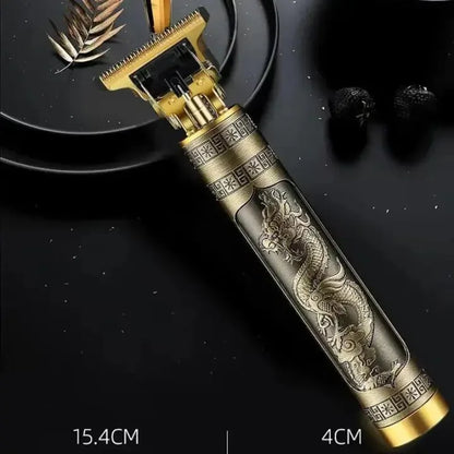 Close-up of a dragon engraved cordless T-blade hair trimmer with an all-metal body and precision cutting blade, designed for professional haircuts, beard trimming, and barber styling.